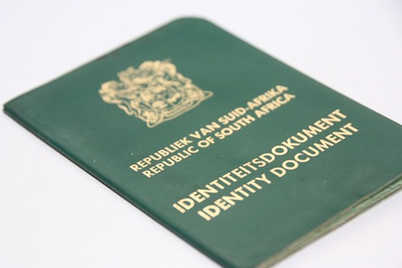 A South African green ID book. The cover features the South African coat of arms and the words Republic of South Africa Identity Document in gold. This ID book is used for applications and identification purposes.